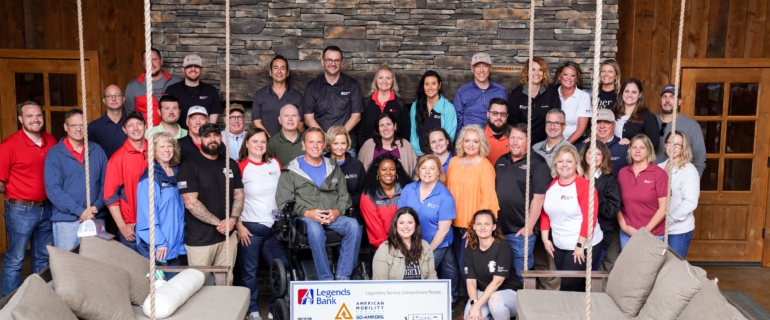 group picture at fundraiser holding check.